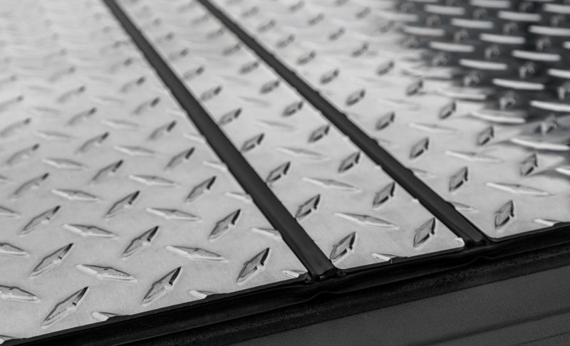Access LOMAX Tri-Fold Hard Tonneau Cover for 2022-2023 Nissan Frontier with 5ft Bed – Diamond Plate Finish